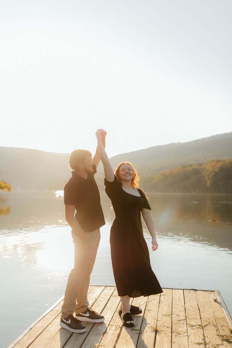 couple dancing by lake