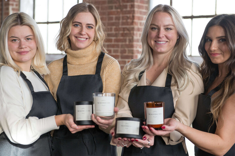group of women with custom candles