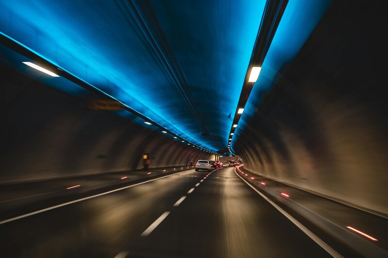 Motion-blurred tunnel scene representing organizational flow and forward momentum.