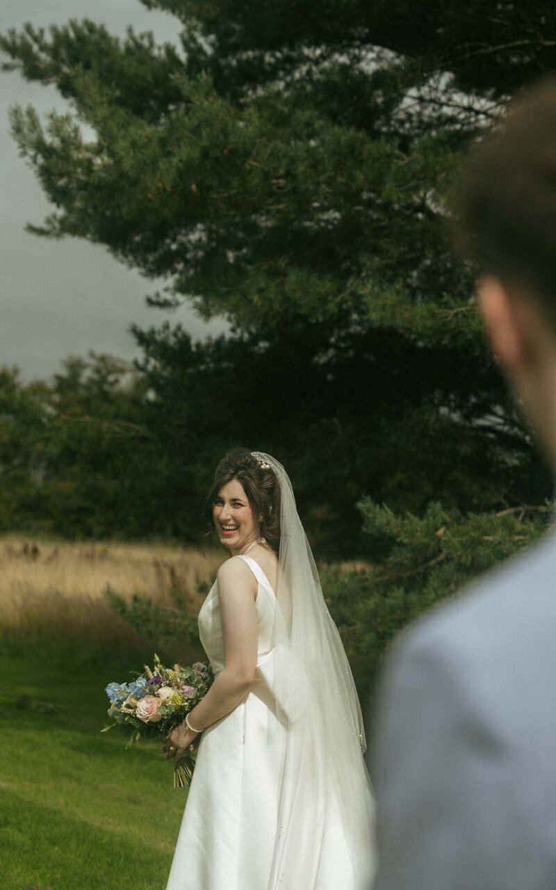 Capturing a moment of love as the bride gazes at her groom, showcasing a tender and emotional connection during their special day