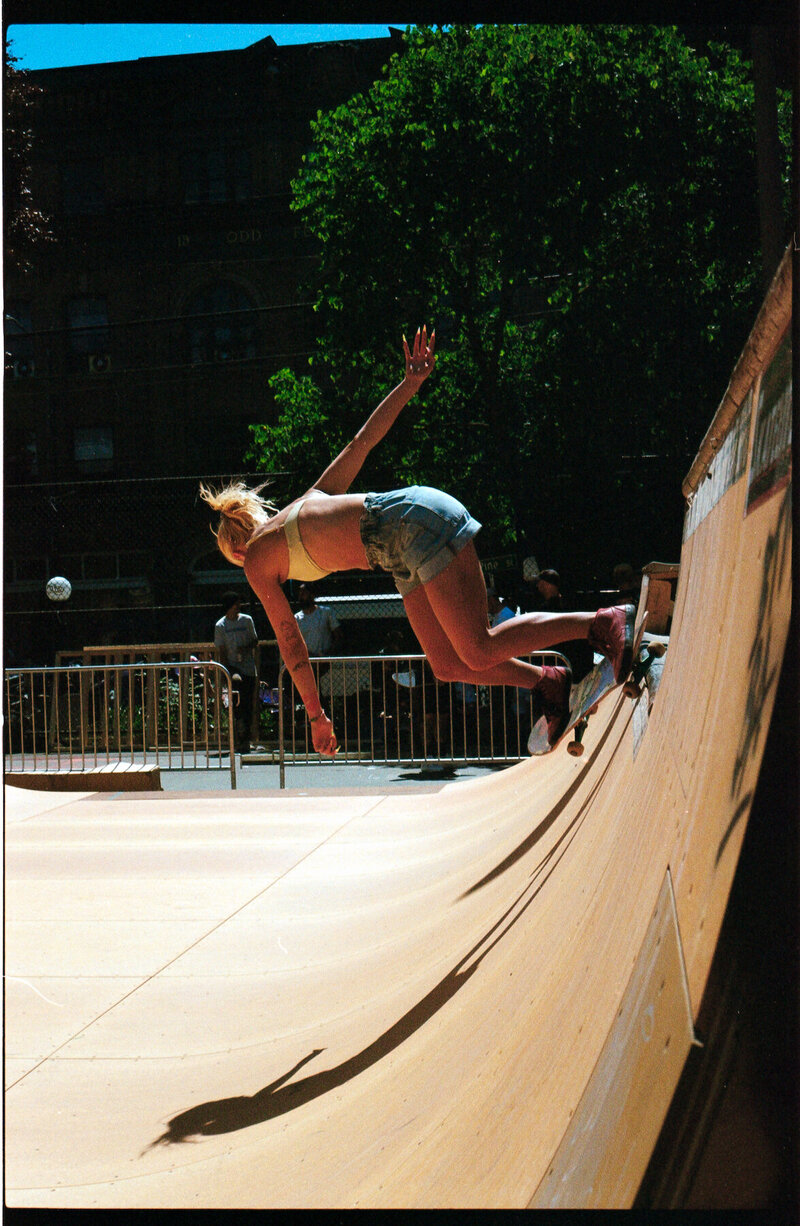 Badass skater girl shredding the half pipe