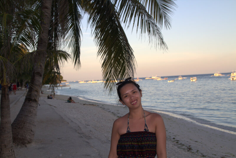 Woman in the beach with sunset