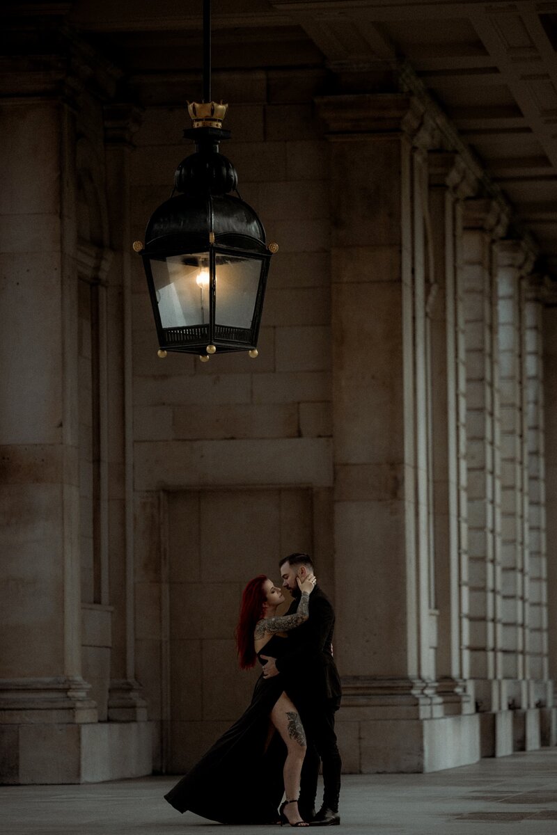 Couple wearing black  wedding dress posing for London elopement wedding photographer at Old Royal Naval College Greenwich