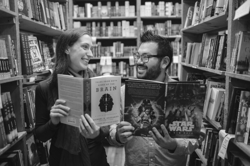 Engaged couple in a book store in Seattle.