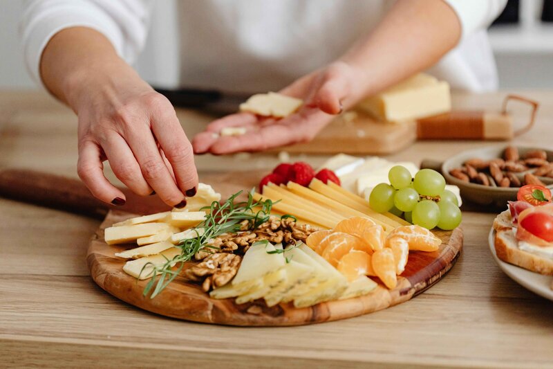 Variety of cheeses, fruits and herbs