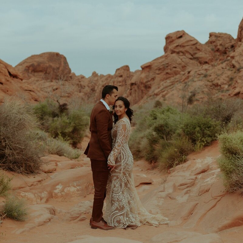 bride and groom hugging in canyon