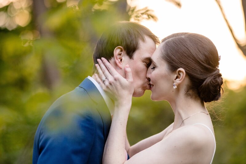 a couple embraces on their wedding day.  