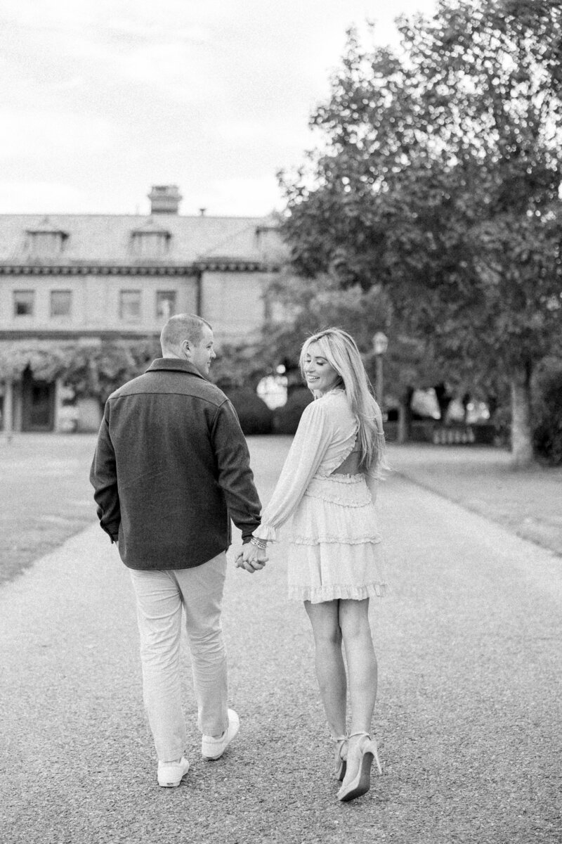 Newport Photographer Serving CT, RI, and beyond | The Corteses | Couple holding hands while walking