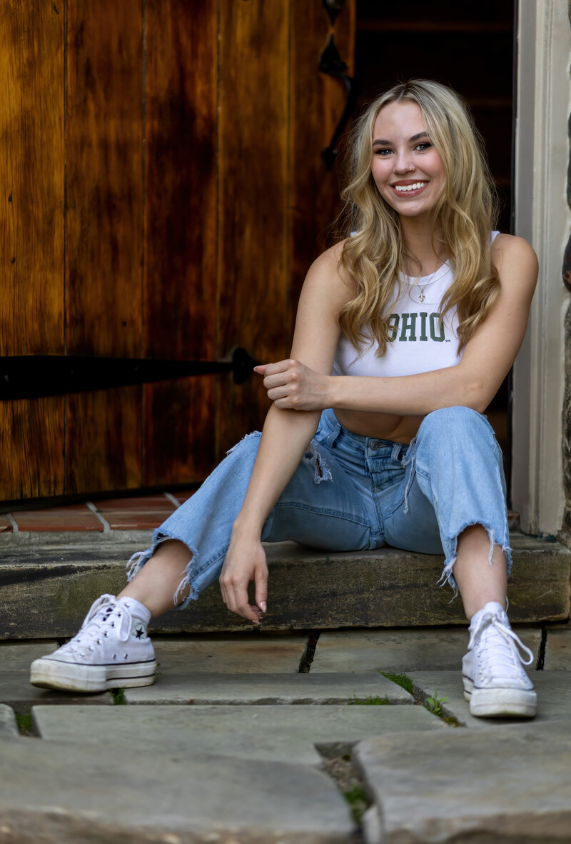 A  senior wears an OHIO shirt at her home.