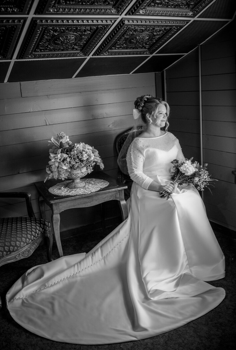 black and white bridal portrait by a window