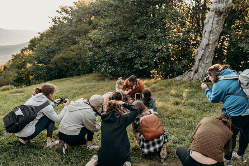 group of photographers taking photos of family