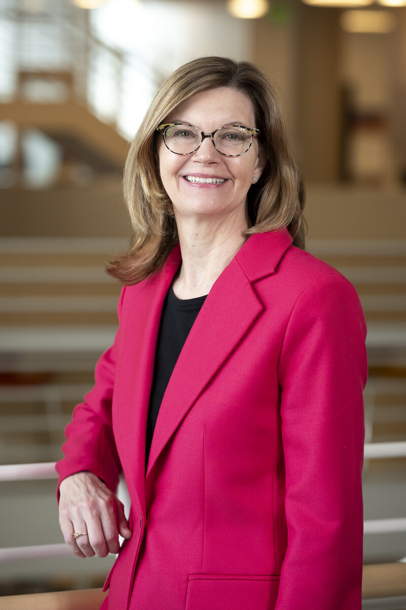 Professor Dionne Koller, a distinguished law professor with expertise in sports law, smiling confidently in a professional headshot.