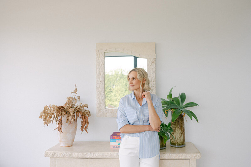 Zelda Green, entrepreneur and money and mindset educator, looking happy and relaxed in a beautiful home