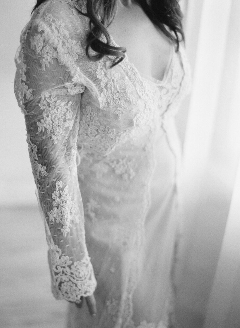 A close up image in a vintage lace robe, taken by Denver boudoir photographer.