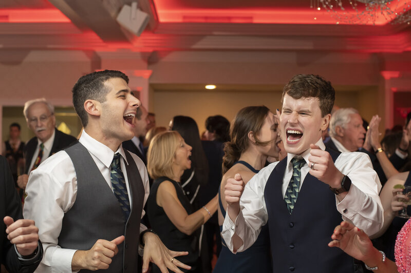 Wedding guests singing during a reception 