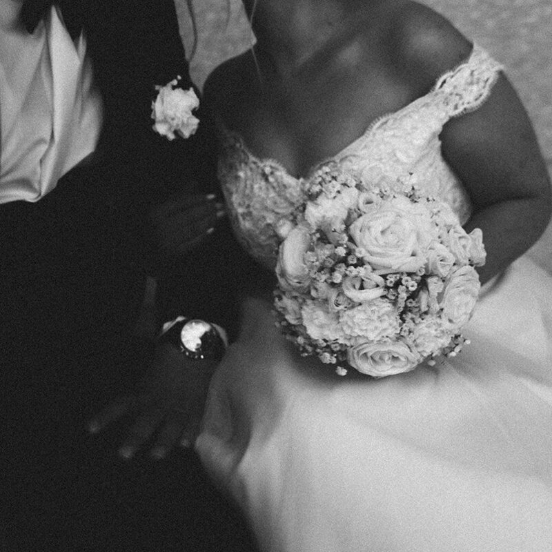 A film portrait of a bride holding her husband with her bouquet at Museum Island in Germany by Eilish Burt Photography