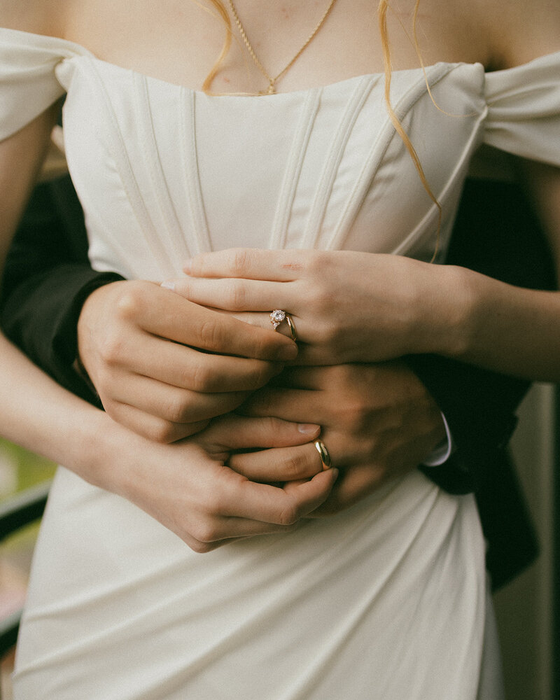 bride and grooms hands in front of bride