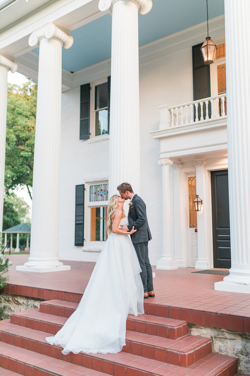 Bride and groom kissing on their wedding day