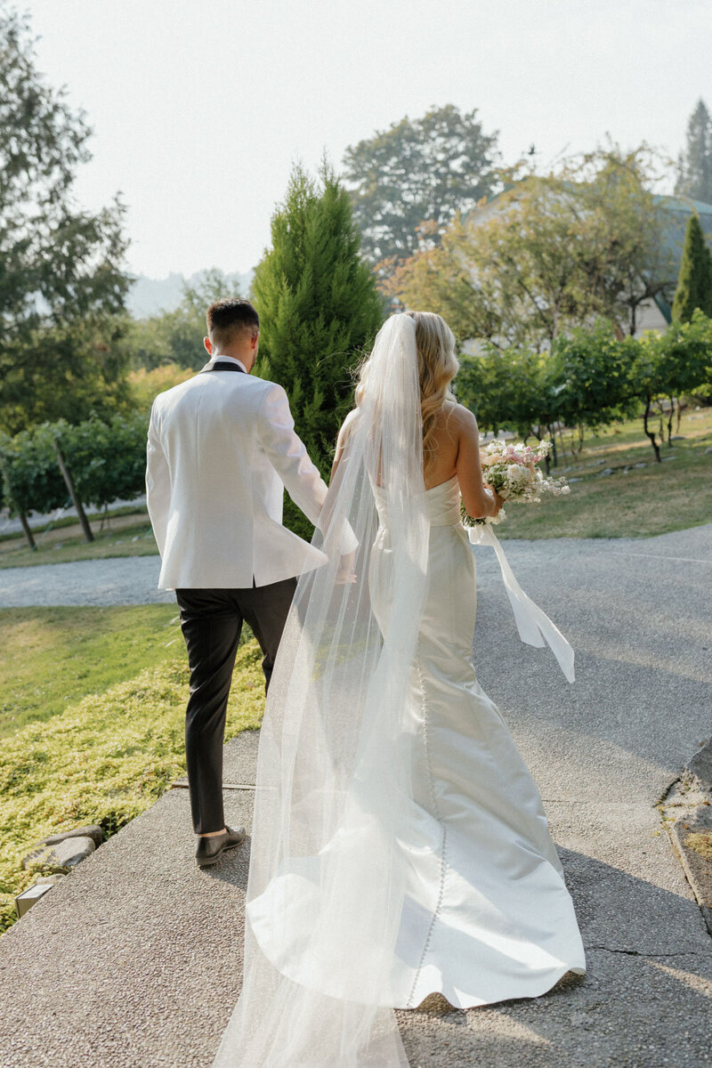 Bride and groom happily walking away