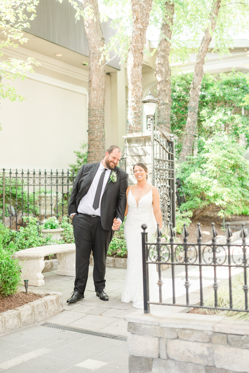 Bride and groom laughing together after sharing a first look in Saginaw Michigan.