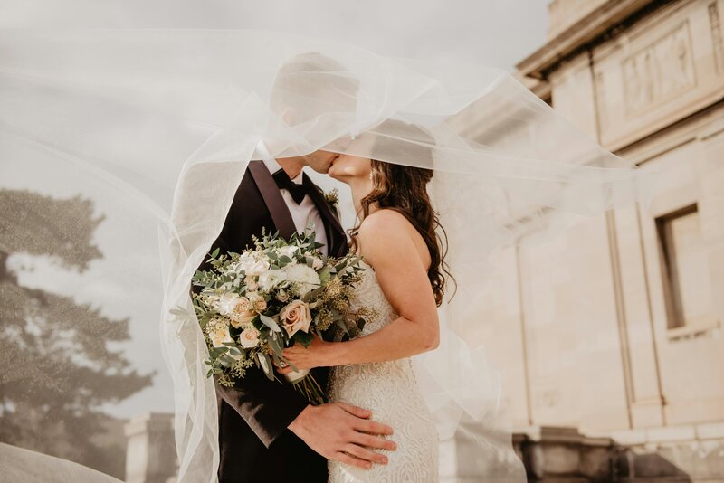 veil and bride and groom