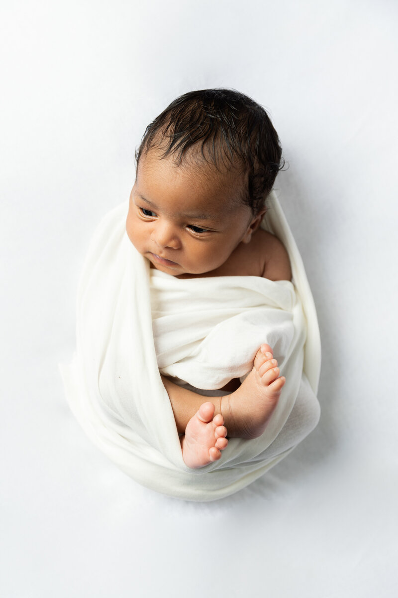 Beautiful newborn captured at home on the pop-up studio.