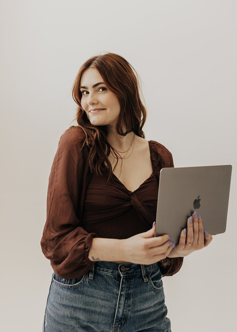 Madison Ashlee holding laptop