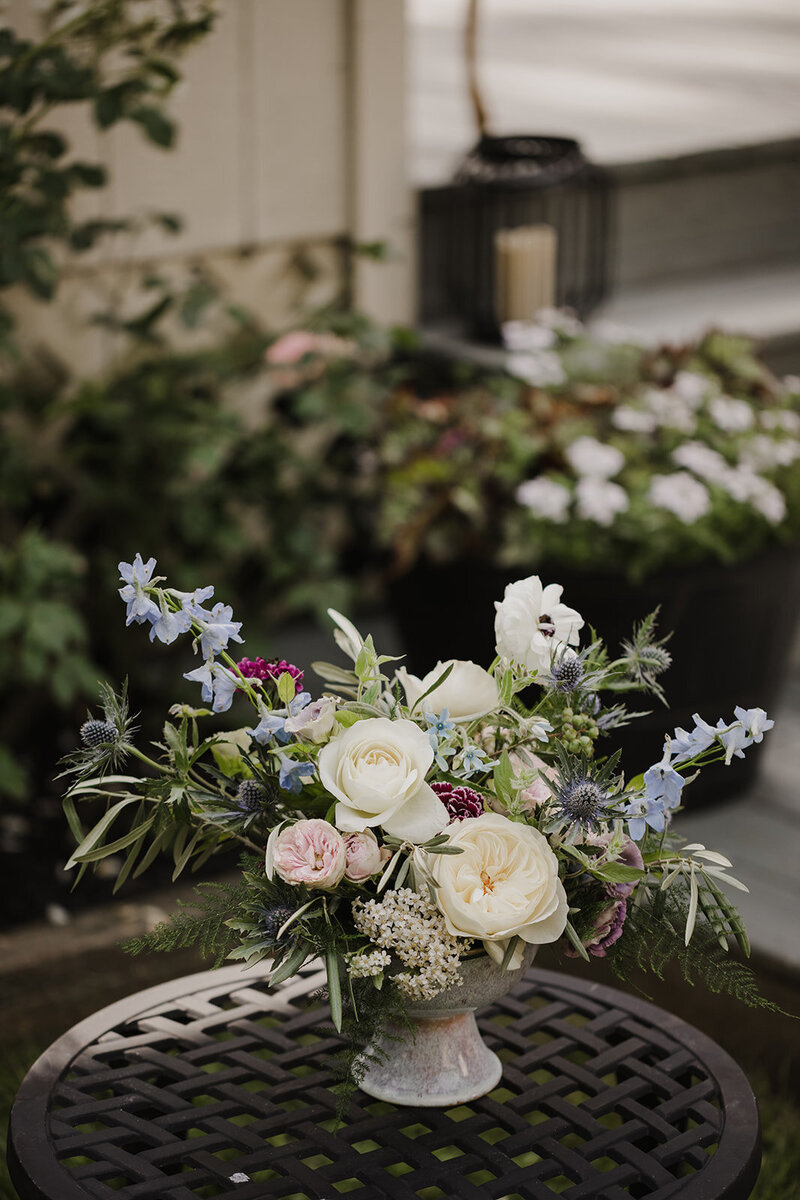 Flower arrangement in a stone vase designed by Jessamine Floral & Events, New Jersey wedding Florist