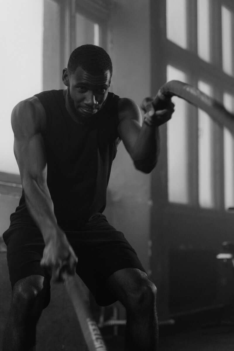 Man using ropes in a gym