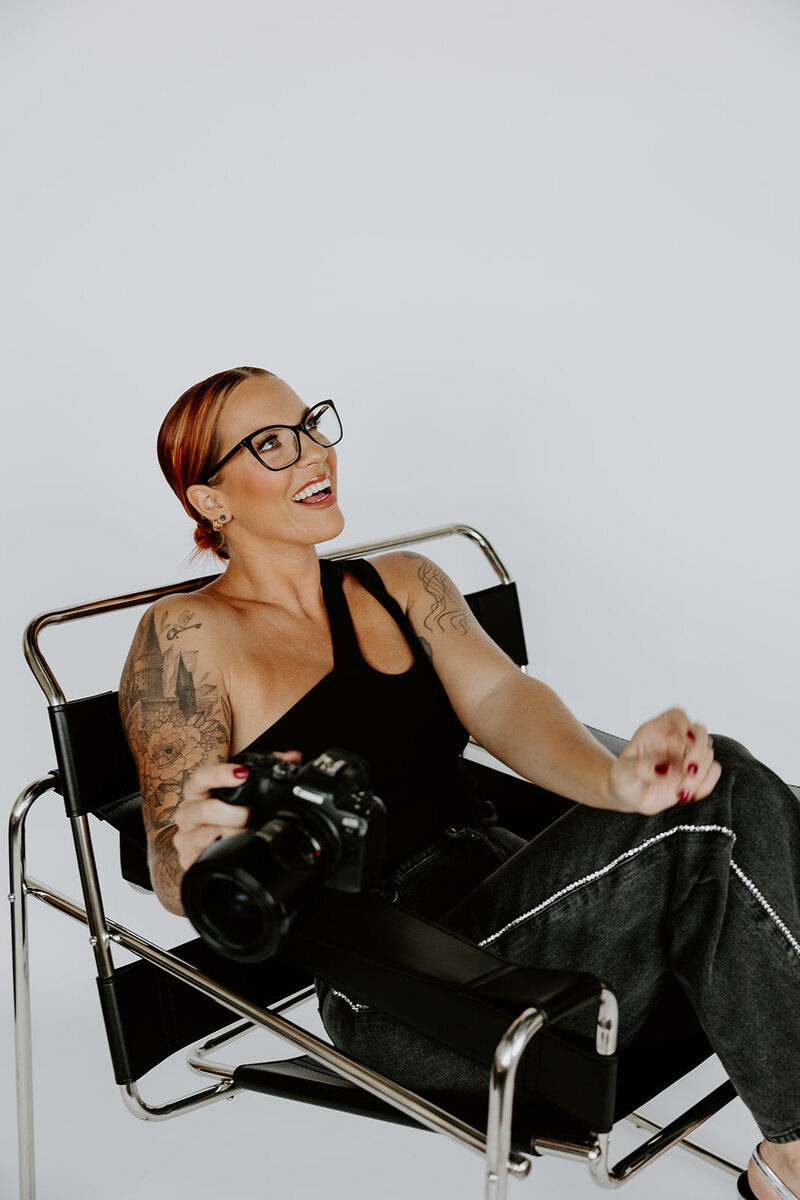 woman sitting on a white scooter eating pizza