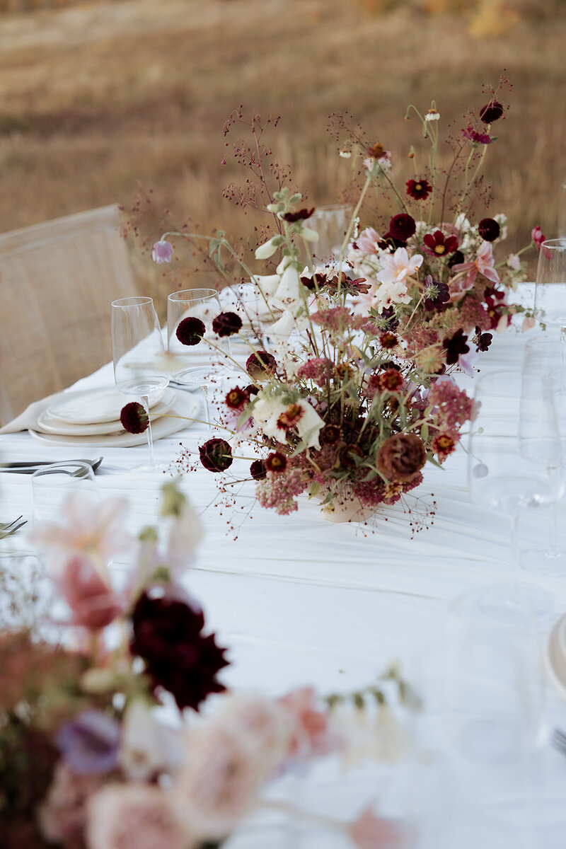Floral details on a reception table at a wedding.