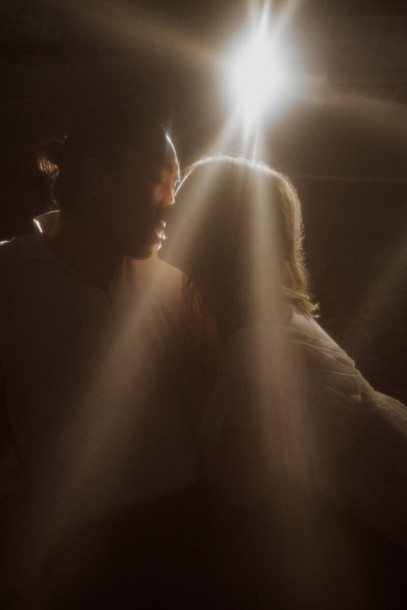 cinematic engagement session couple kissing