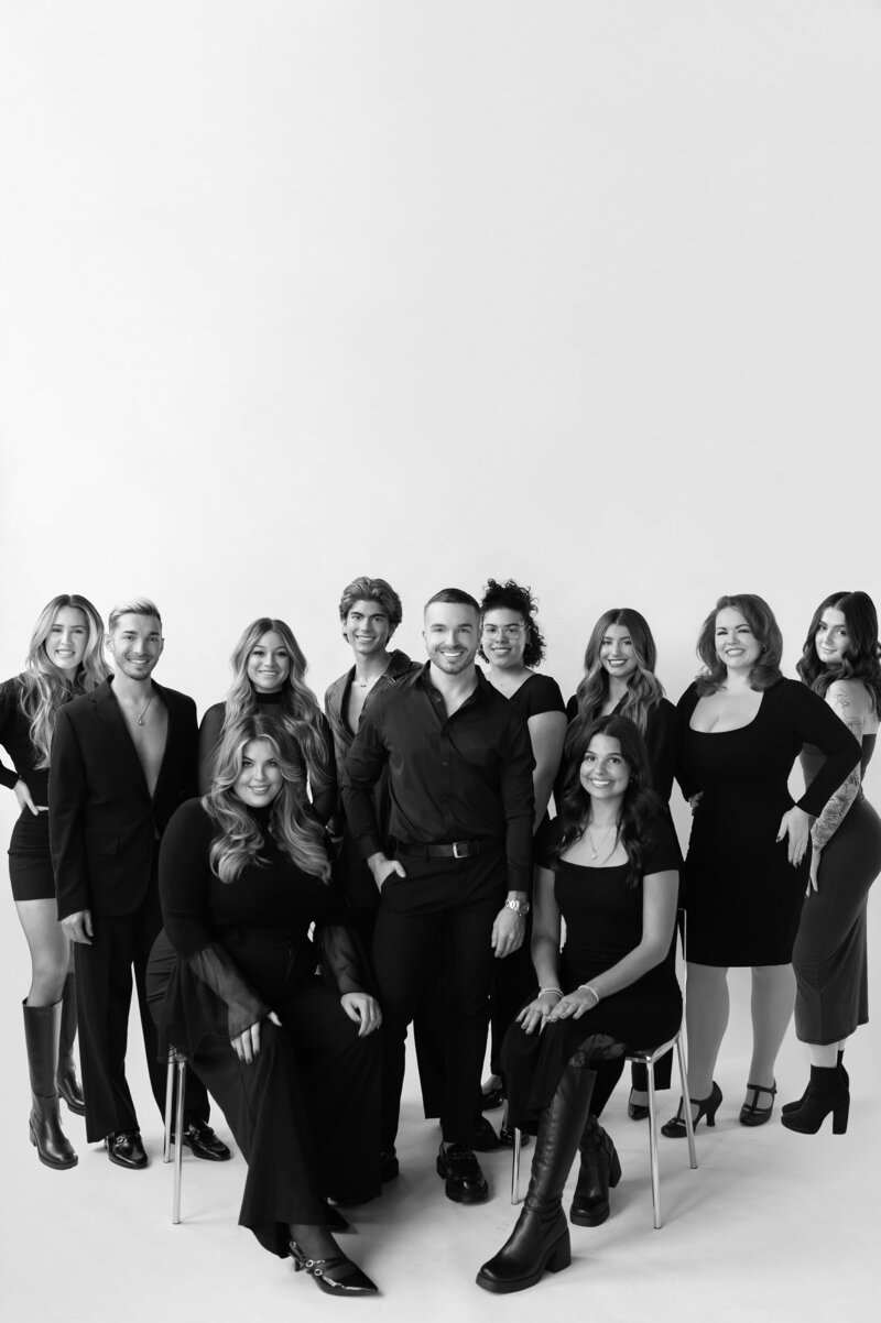 Black-and-white portrait of the Salon Beau team, delivering modern hair styling and coloring.