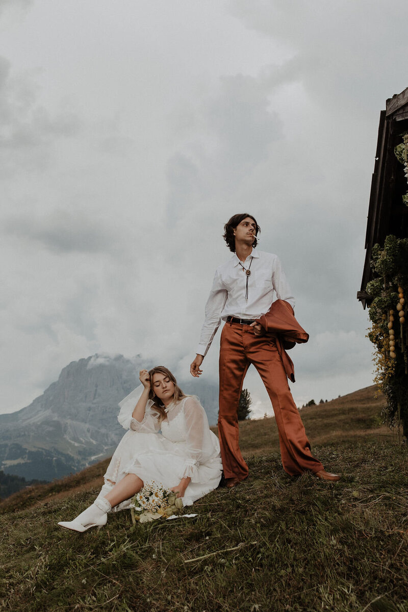bride and groom on hillside