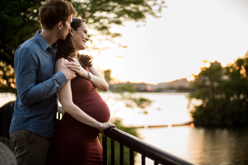 expectant couple at the Charles River