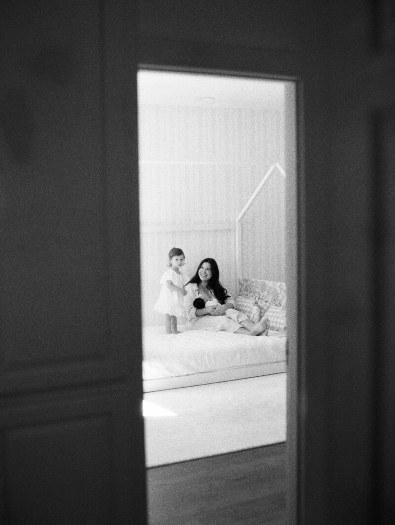 Black and white film candid family photo for Seattle family in their home.