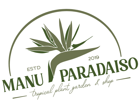 A logo with a green bird of paradise flower head in the center, with 'ESTD 2019' directly underneath it. Below that is green 'Manu Paradaiso' and 'tropical plant garden & shop' creating a hard line at the bottom of an half circle enclosing the top half of the logo.