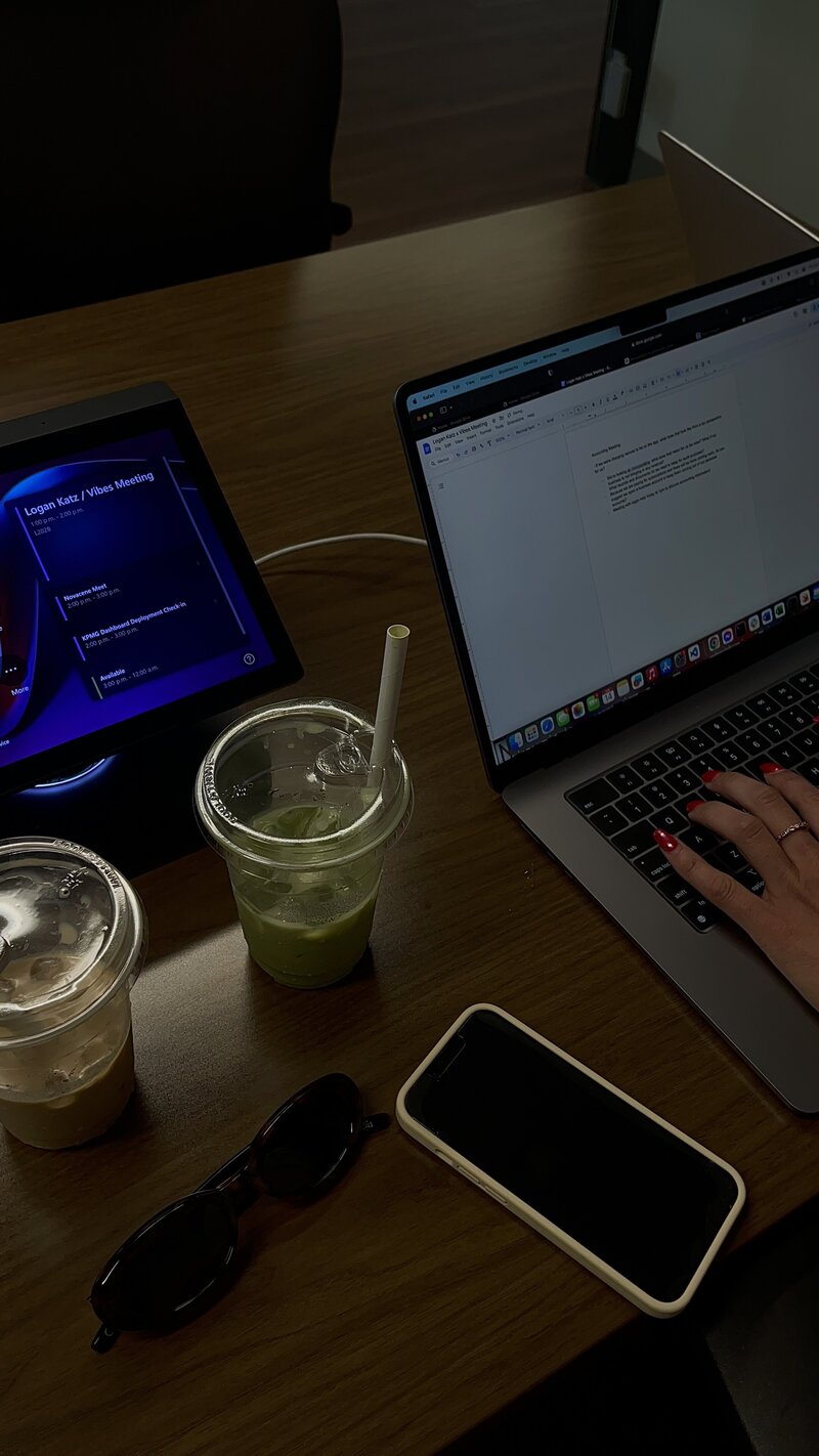 Blurred photo of a woman setting up a ring light