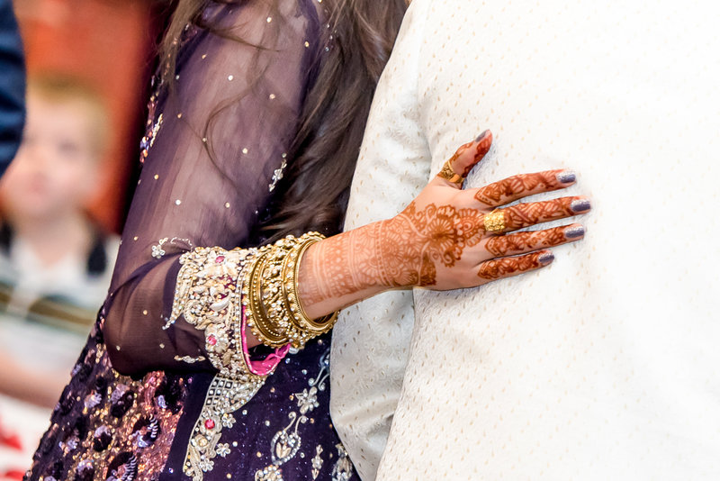 An upclose shot of henna tattoo during a wedding reception