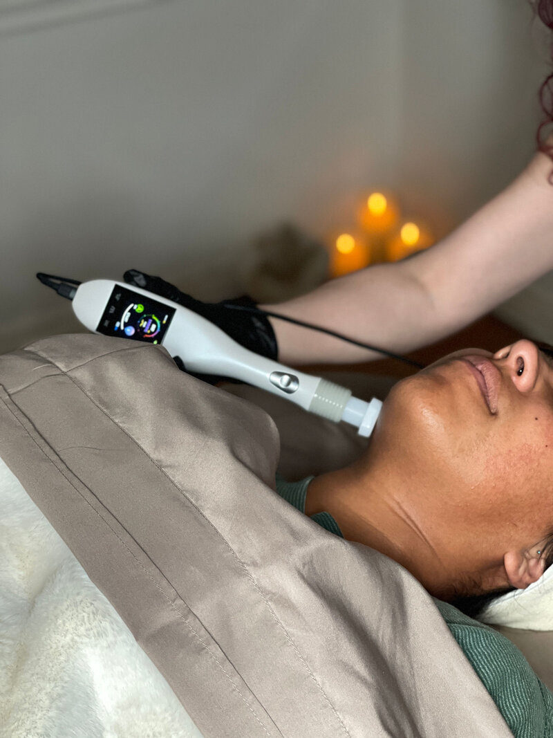 Non-invasive Jet Plasma treatment session on client’s face.