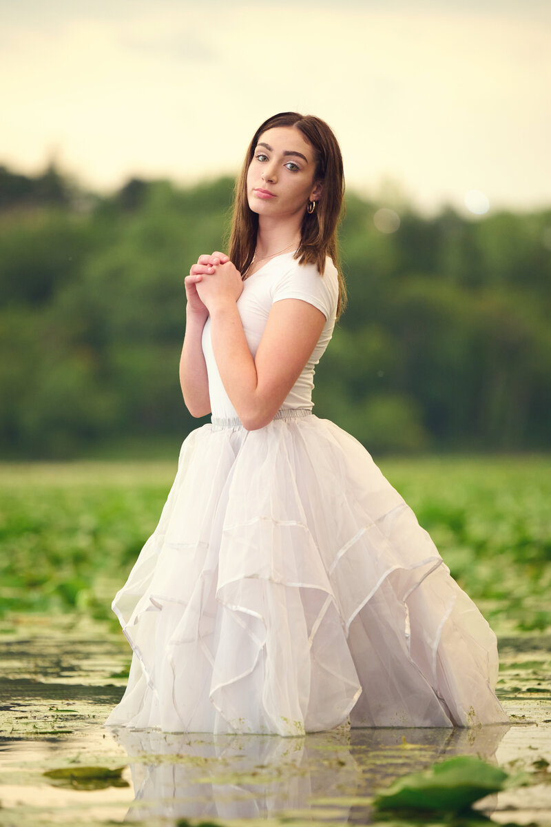 Photographer Senior epic in lake pond lilypads dress8