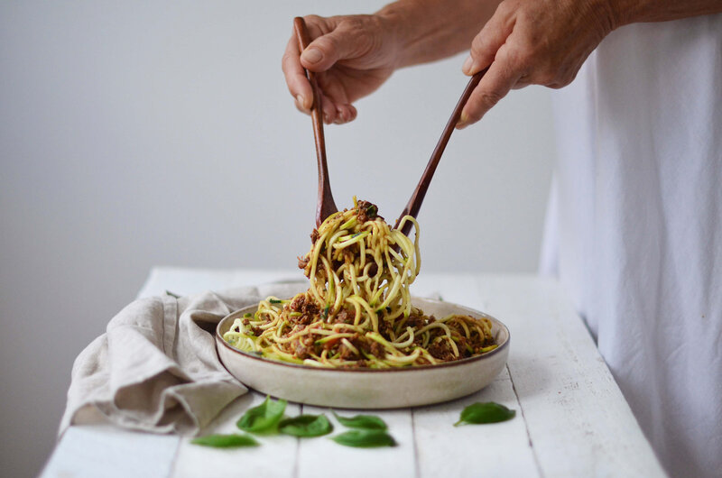Colourful raw vegan zucchini noodle dish