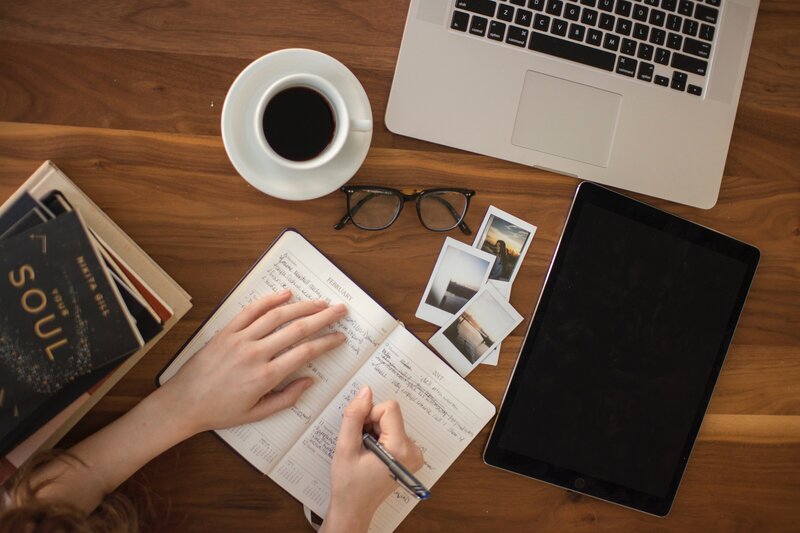 woman in front of laptop studying about real estate investment