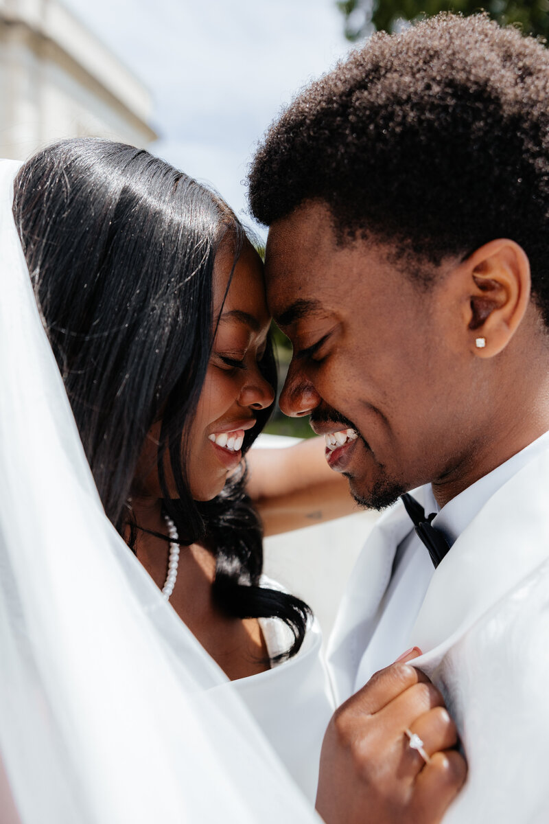 Bride and groom posing together.