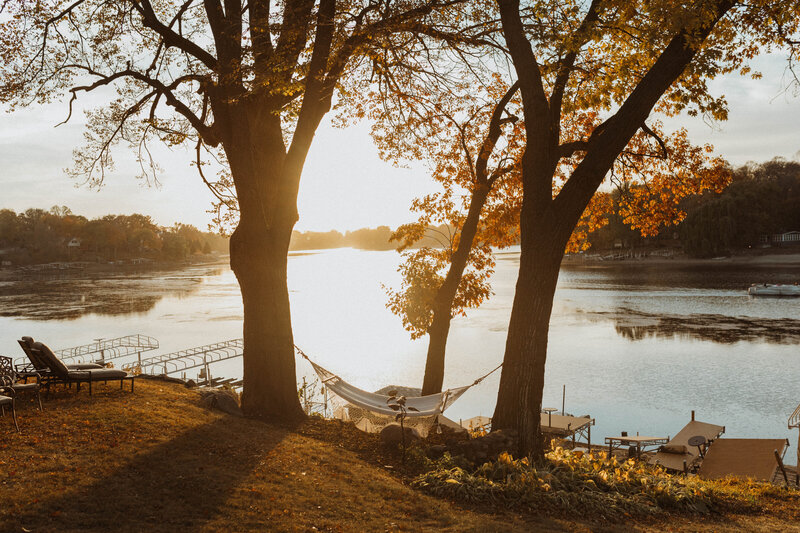 An intimate backyard dress-rehearsal with close friends and family celebrating the bride and groom before the most important day of their lives. Located near Lake Minnetonka, Lydia and Nicholas enjoy a beautiful sunset and a warm fall night with the people they love.