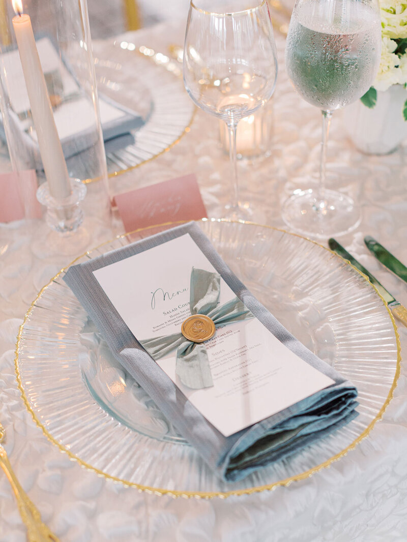 Elegant wedding place setting with menu and ribbon detail