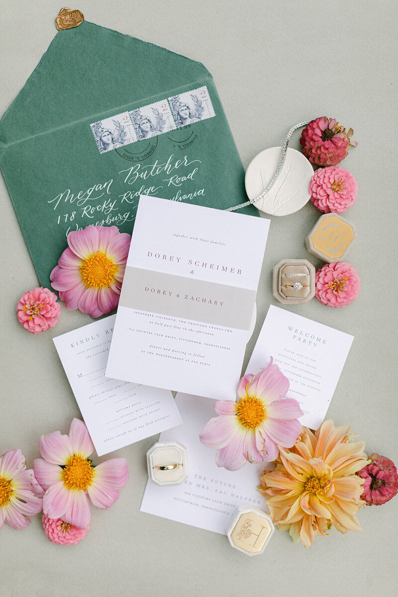 Sage suede styling mat with botanical details and vow books