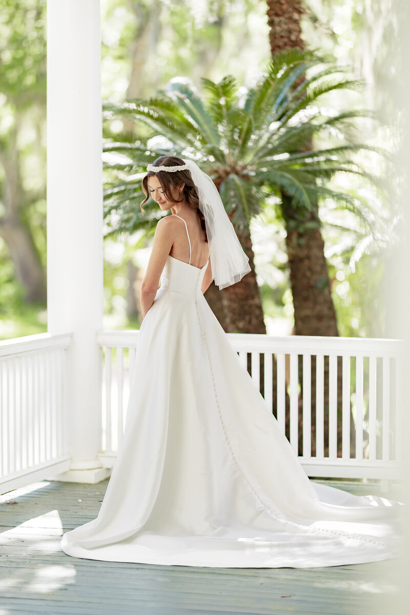 A bride posing in her dress.