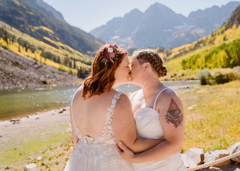 LGBTQ couples elopes at Maroon bells Amphitheater in Aspen, Colorado in the fall