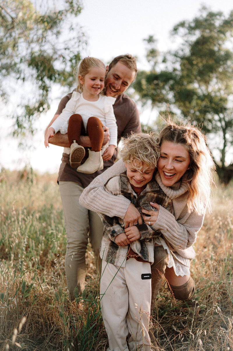 Parents and kids playing together outdoors in Perth